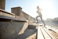 Happy young man running upstairs on stadium Royalty Free Stock Photo