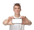 Happy young man show display of mobile cell phone with blank screen Royalty Free Stock Photo