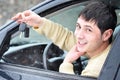 Happy young man showing his car keys Royalty Free Stock Photo