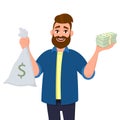 Happy young man is showing or holding money bag, cash bag and bunch of money, cash, currency, dollar bills, banknotes in hand. Royalty Free Stock Photo