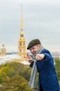 Happy young man shows victory gesture (V sign) and clenched fist. Royalty Free Stock Photo