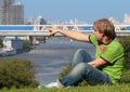 Happy young man sitting on the grass Royalty Free Stock Photo