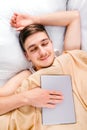 Young Man sleep with a Tablet Royalty Free Stock Photo