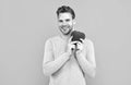 Happy young man smile holding Valentines heart grey background, love