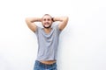 Happy young man smiling with hands behind his head Royalty Free Stock Photo