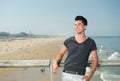 Happy young man smiling on vacation at the beach Royalty Free Stock Photo