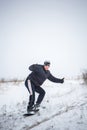 Happy young man with snowboard enjoying sunny weather in snowy mountains. Winter sport and recreation, leasure outdoor activities Royalty Free Stock Photo