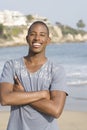 Happy Young Man Standing On Beach Royalty Free Stock Photo