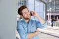 Happy young man talking on mobile phone Royalty Free Stock Photo