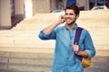 Happy young man talking phone and smiling Royalty Free Stock Photo