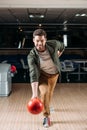 happy young man throwing bowling ball Royalty Free Stock Photo