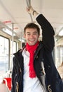 Happy young man traveling with public transport Royalty Free Stock Photo