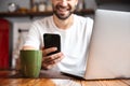 Happy young man using laptop computer Royalty Free Stock Photo