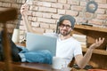 Happy young man using laptop at home Royalty Free Stock Photo