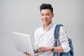 Happy young man using laptop on white background Royalty Free Stock Photo