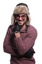 Happy young man in warm sweater and fur hat Royalty Free Stock Photo