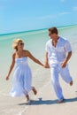 Happy Young Man Woman Couple Running on A Beach Royalty Free Stock Photo