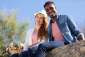 happy young man and woman smiling outdoors