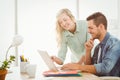 Happy young man and woman working on laptop Royalty Free Stock Photo