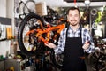 Man working on master mechanic assembling bicycle equipment Royalty Free Stock Photo