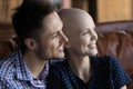 Happy young married couple going through oncology disease