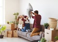 Happy young married couple moves to new apartment and laughing, Royalty Free Stock Photo