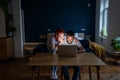 Happy young married multiracial couple using laptop together at home, planning summer vacation Royalty Free Stock Photo