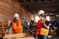 The woman inspector checks the work of a man in a warehouse Royalty Free Stock Photo