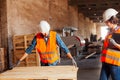 The woman inspector checks the work of a man in a warehouse Royalty Free Stock Photo