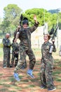 Happy young man and woman in full paintball gear having fun after match Royalty Free Stock Photo