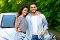 Happy young middle-eastern couple showing key from car Royalty Free Stock Photo