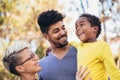 Young mixed race couple spending time with their daughter having fun Royalty Free Stock Photo