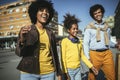 Happy young mixed race couple spending time with their daughter in shopping Royalty Free Stock Photo