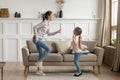 Happy mom and little kid daughter laughing dancing at home Royalty Free Stock Photo