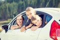 Happy young mom and her children sitting in a car Royalty Free Stock Photo