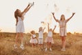 Happy young moms playing with their kids outdoors in summer. Happy family time together concept. selective focus Royalty Free Stock Photo