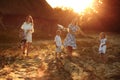 Happy young moms playing with their kids outdoors in summer. Happy family time together concept. selective focus Royalty Free Stock Photo