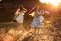 Happy young moms playing with their kids outdoors in summer. Happy family time together concept. selective focus Royalty Free Stock Photo