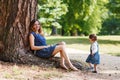 Happy young mother and adorable toddler girl walking through sum Royalty Free Stock Photo