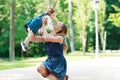 Happy young mother and adorable toddler girl walking through sum Royalty Free Stock Photo