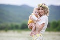 A happy young mother gently holds her newborn son in her arms Royalty Free Stock Photo