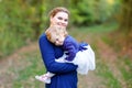 Happy young mother having fun cute toddler daughter, family portrait together. Woman with beautiful baby girl in nature Royalty Free Stock Photo