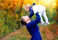 Happy young mother having fun cute toddler daughter, family portrait together. Woman with beautiful baby girl in nature Royalty Free Stock Photo
