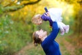 Happy young mother having fun cute toddler daughter, family portrait together. Woman with beautiful baby girl in nature Royalty Free Stock Photo