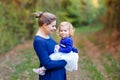 Happy young mother having fun cute toddler daughter, family portrait together. Woman with beautiful baby girl in nature Royalty Free Stock Photo