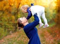 Happy young mother having fun cute toddler daughter, family portrait together. Woman with beautiful baby girl in nature Royalty Free Stock Photo