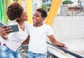 Happy young mother having fun with her child in summer sunny day - Son taking selfie with his mum outdoor - Family lifestyle, Royalty Free Stock Photo