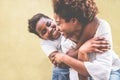 Happy young mother having fun with her kid - Son hugging his mum outdoor - Family connection, motherhood, love and tender moments