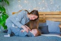 Happy young mother and her baby son playing togerher Royalty Free Stock Photo