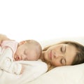 Happy young mother with her sleeping newborn baby Royalty Free Stock Photo